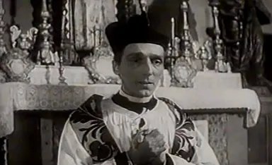 Milan Lentić u ulozi svećenika u filmu Cesta duga godinu dana